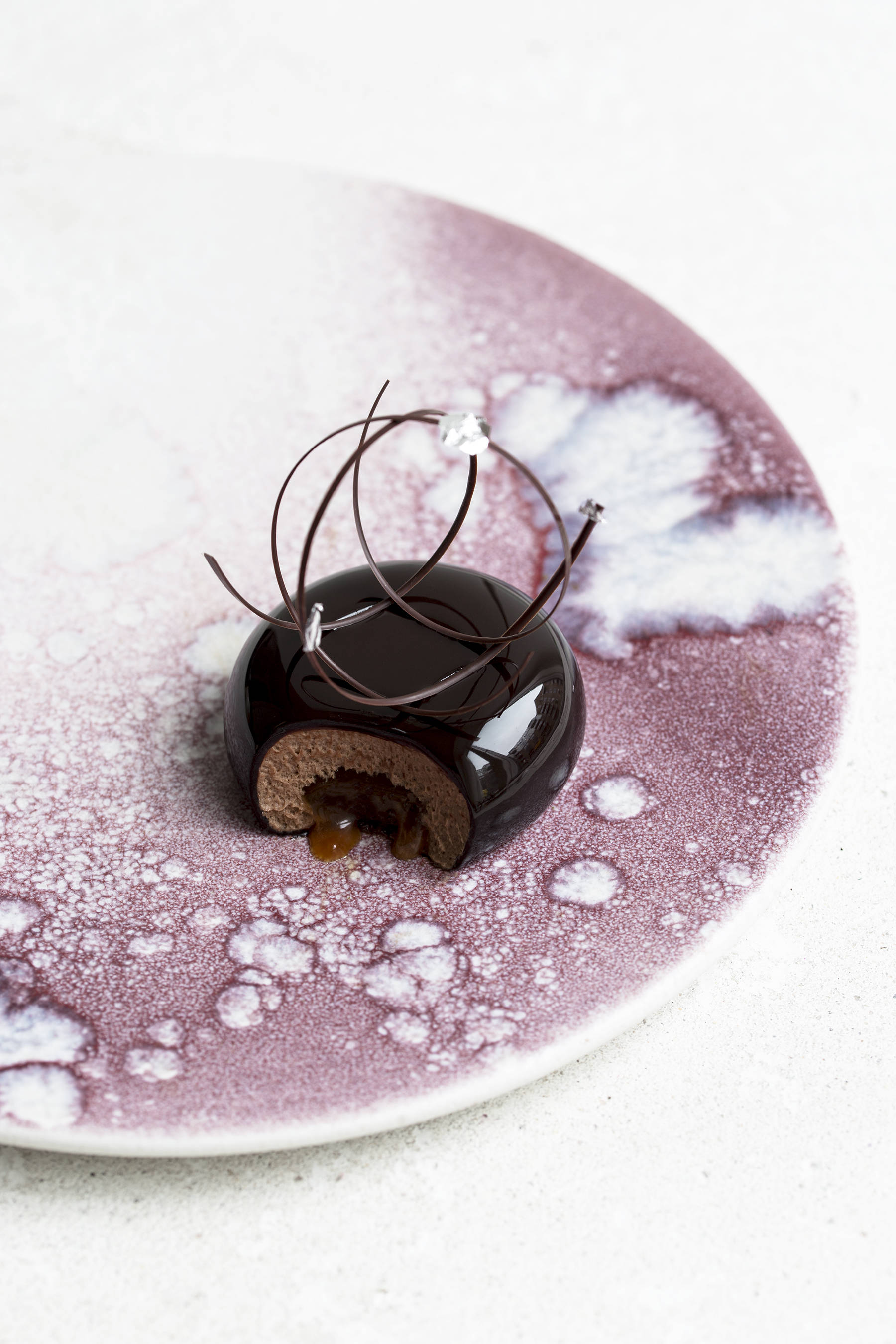 Chocolate mousse cake with passion fruit caramel